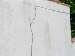 Large crack in wall, a sign of potential structural issues. Wall cracks keep coming back.