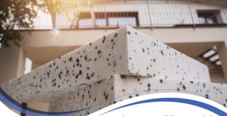 Polystyrene building material sheets stacked outside modern residential house.