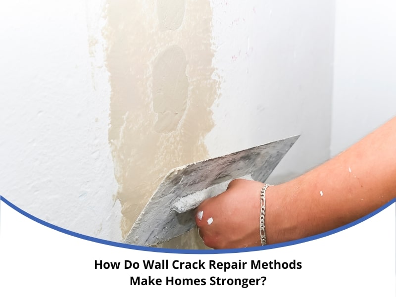 Applying plaster to fix cracks using Wall Crack Repair Methods.