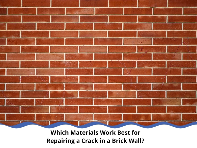 Red brick wall with small visible cracks showing the early signs of a crack in brick wall.